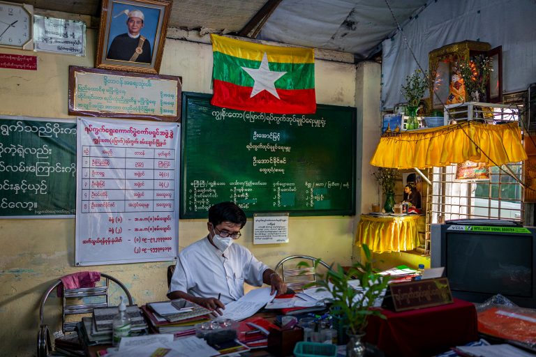 Administrator U Aung Myint at work in his office in Kyun Taw-North ward, in Yangon's Sanchaung Township, on January 14. (Hkun Lat | Frontier)