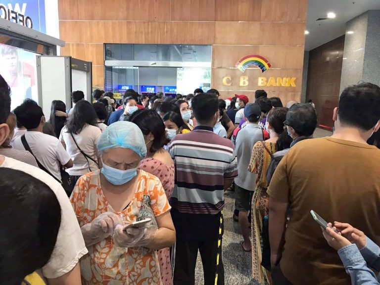 Customers line up to withdraw cash from CB Bank ATMs in Yangon on May 5. (Frontier)
