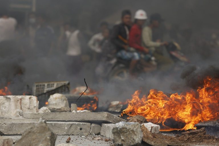 A barricade burns at an anti-coup protest in Mandalay's Chan Mya Tharzi Township on March 21. (Frontier)