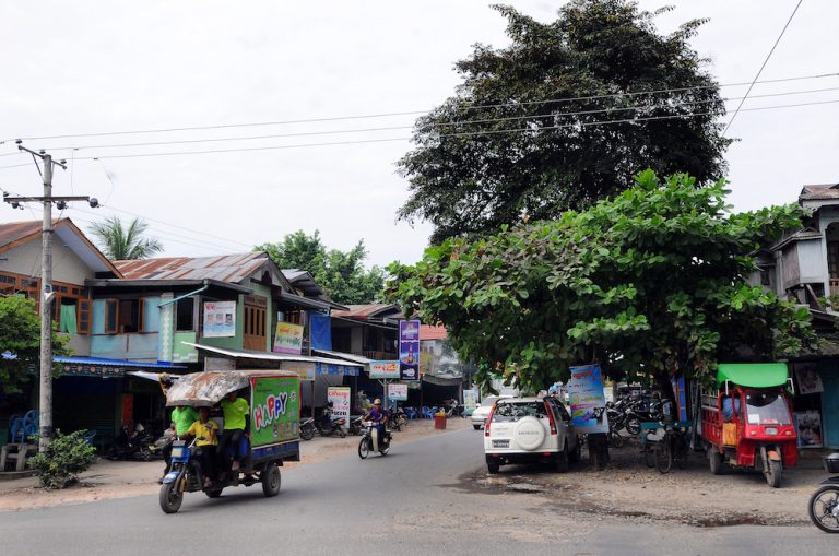 A three-wheeled motorbike taxi cruises the streets of downtown Myitkyina on October 5, 2015. Support for the NLD ran high then, but it has since waned among ethnic groups in Kachin State. (Steve Tickner)