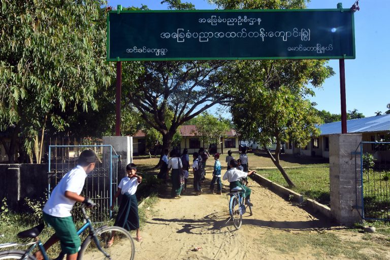 Children arrive at a school in Inn Din village, Maungdaw Township, in November 2018. (Steve Tickner | Frontier)