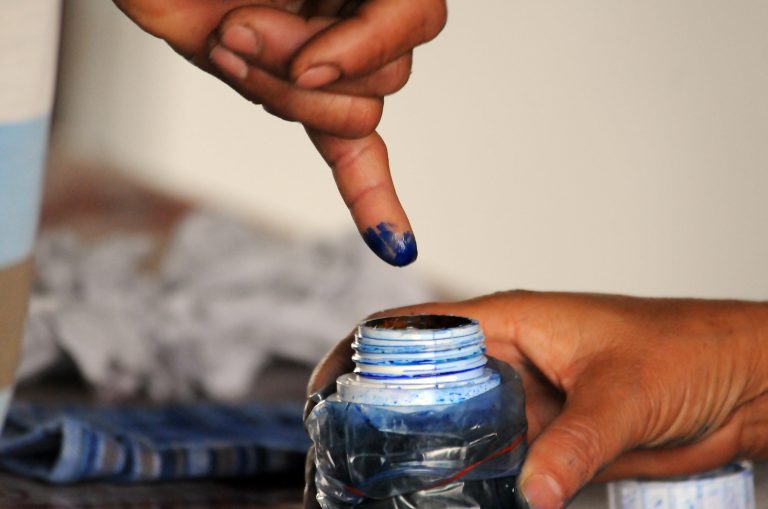 A voter dips their finger in indelible ink during by-elections in April 2017. (Steve Tickner | Frontier)