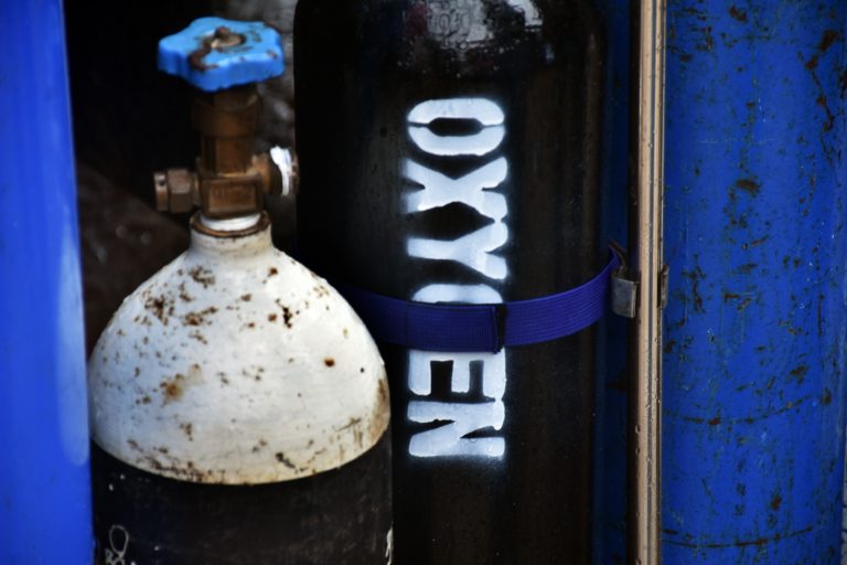 Yangon citizens gather at private oxygen supplier MateSet refilling station in South Dagon on July 13, 2021. (Frontier)