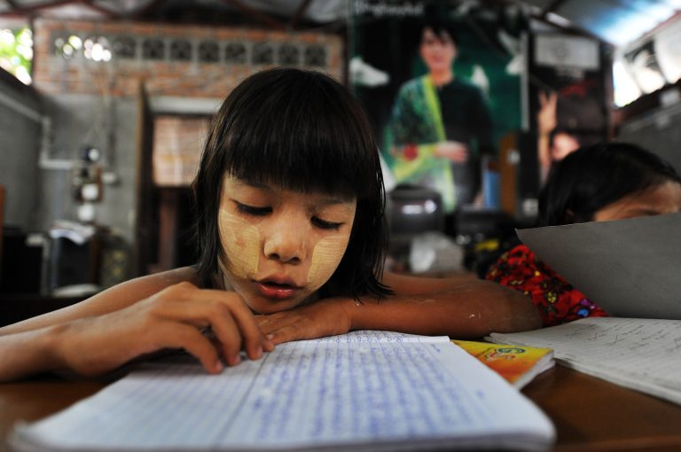 A young girl studies at an NLD-sponsored school in 2012 (Frontier)