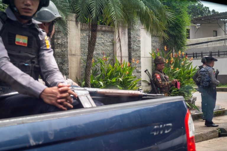 Police patrol on a street in Yangon on July 19. (AFP)