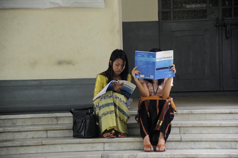 Students study ahead of an English exam at the University of Yangon on March 19, 2015. (AFP)