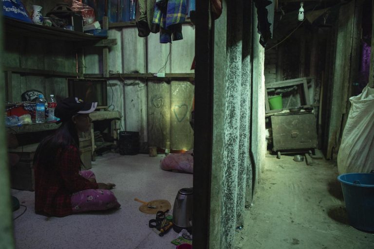 A garment factory worker who lost her job, pictured in her dorm room in the working-class Hlaing Tharyar Township in March 2021. (Frontier)