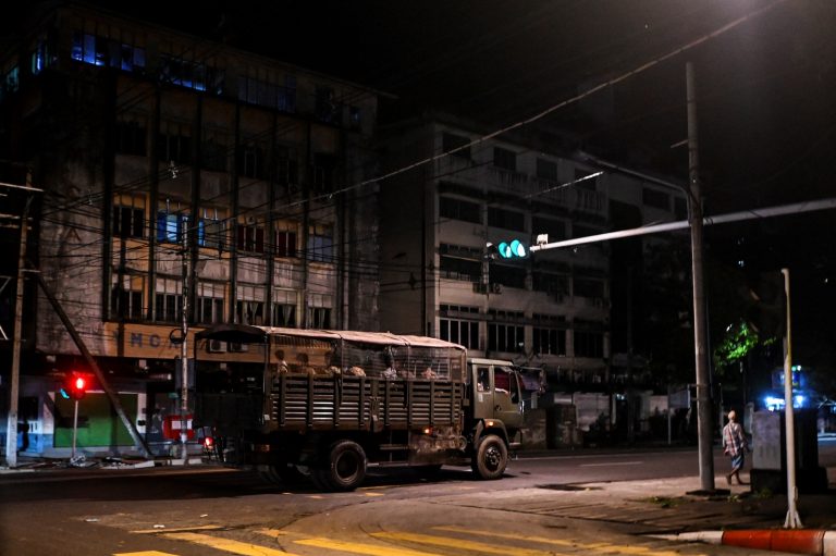 Soldiers patrol in downtown Yangon on the night of November 2, 2021. (AFP)