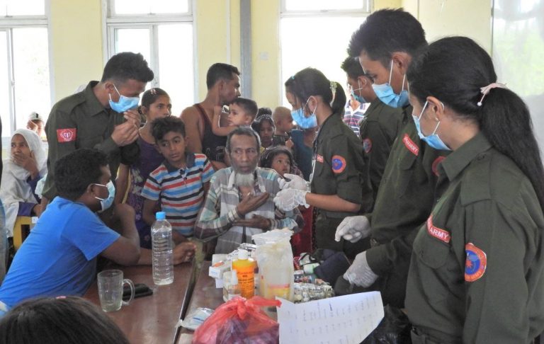 Medical officers from the AA vaccinate civilians for COVID-19 in Rathedaung Township in 2021. (Supplied)