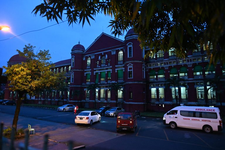 An ambulance passes Yangon General Hospital on June 19, 2019. (AFP)