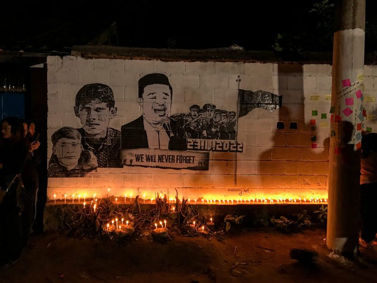 A memorial mural featuring victims of the Hpakant airstrike, including singer Aurali and keyboard player Ko King. (N | Frontier)