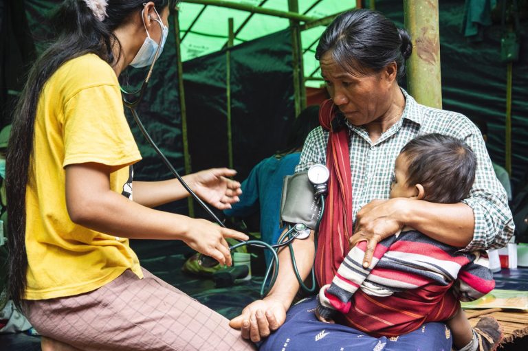 A member of the Loyalty Mobile Team for Karenni provides healthcare to IDPs in Kayah State in August 2022. (Mar Naw | Frontier)