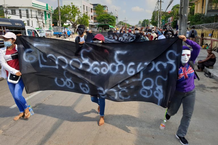 Anti-coup protesters march in northern Yangon's Insein Township on May 1. (AFP)