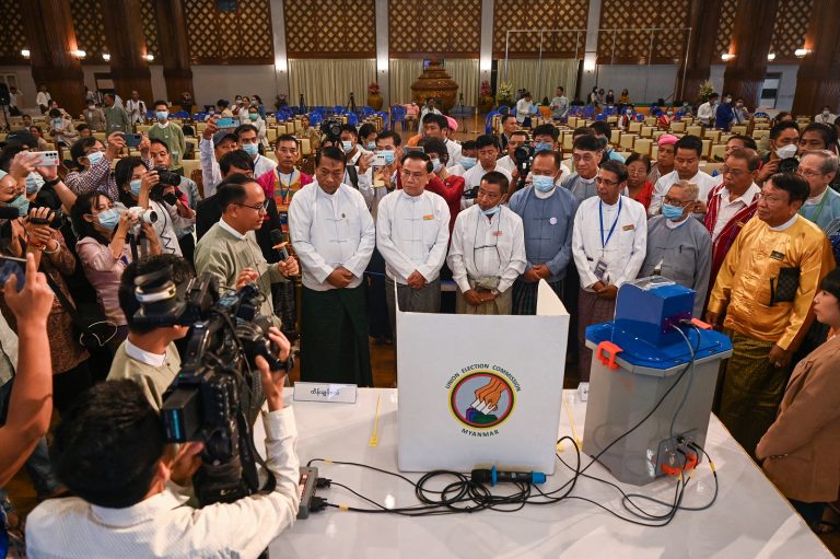 Members of the Union Election Commission speak during a demonstration in Yangon of voting machines to be used in future elections on September 5. (AFP)