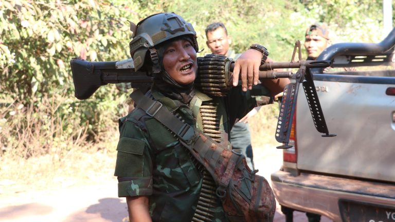 A resistance fighter shoulders a machine gun in preparation for fighting in Kawkareik Township on January 1. (Frontier)