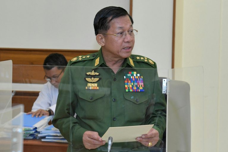 Junta chief Senior General Min Aung Hlaing addresses the National Defense and Security Council in Nay Pyi Taw on January 31, 2023. (Military Information Team | AFP)