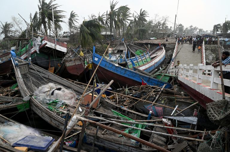 Destroyed boats are piled up next to a broken bridge in Sittwe on May 15, the day after cyclone Mocha's landfall. (AFP)