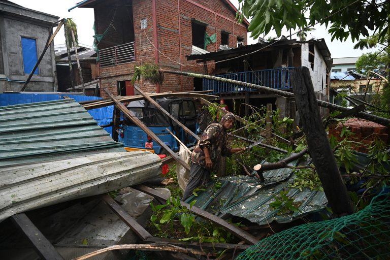 Local residents check the damages after Cyclone Mocha crashed ashore, in Rakhine State's Kyauktaw Township on May 14, 2023. (AFP)