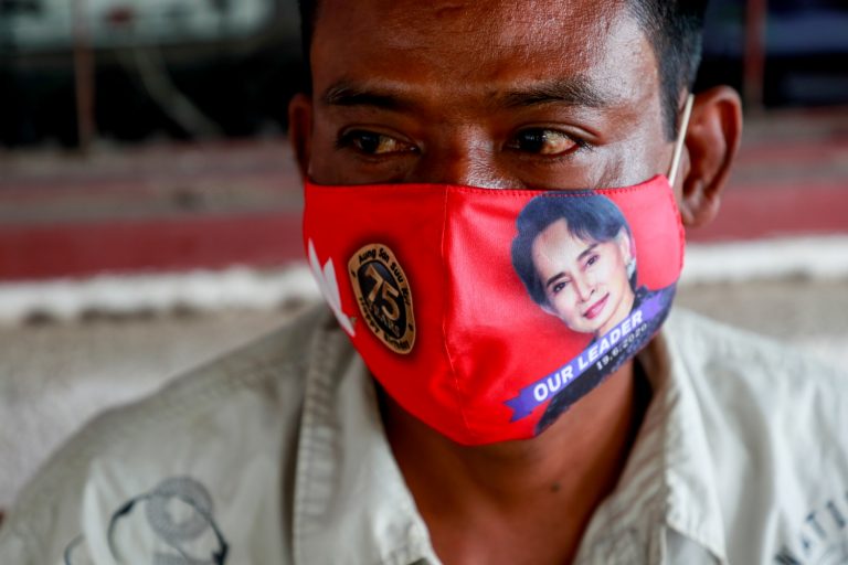 A Pyawbwe local wears a face-mask that commemorates National League for Democracy chair Daw Aung San Suu Kyi's 75th birthday earlier this year. (Nyein Su Wai Kyaw Soe | Frontier)