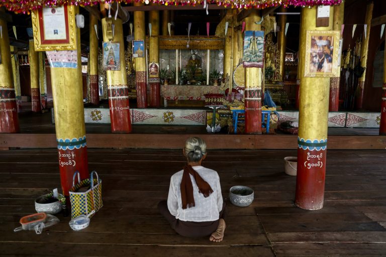 An elderly woman prays at a monastery in Ywathit village, Bawlakhe Township, on August 21. Campaigning in the township has been mostly tame, but some parties have begun accusing one another of unethical electoral tactics – including pressuring elderly voters casting advance votes in the villages to vote for particular candidates.