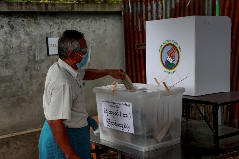 An elderly voter casts an advance ballot in Yangon's Mayangone Township on October 30. (Nyein Su Wai Kyaw Soe | Frontier)