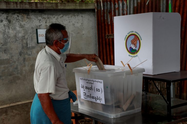 An elderly voter casts an advance ballot in Yangon's Mayangone Township on October 30. (Nyein Su Wai Kyaw Soe | Frontier)