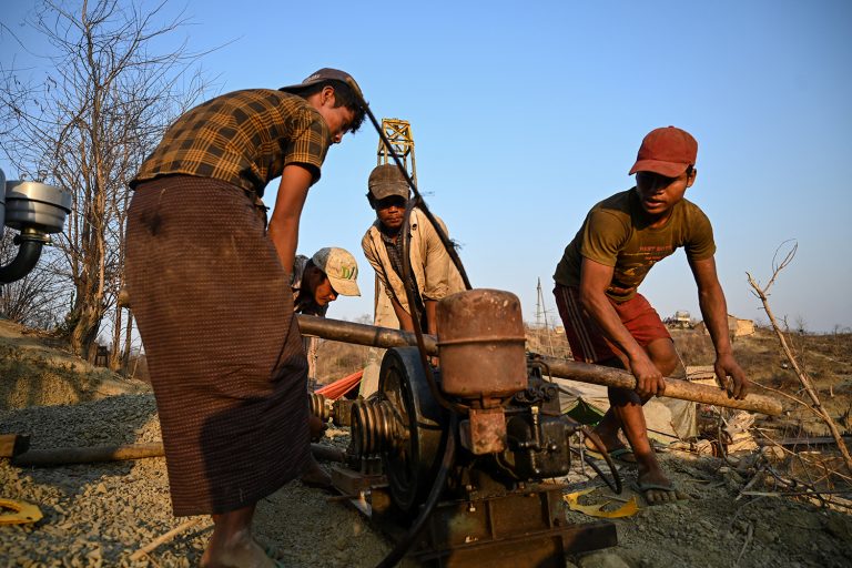 Workers set up a machine to build a new rig at an oil field in Minhla Township, Sagaing Region, on March 10, 2019 . (AFP)