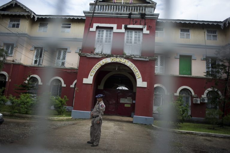 An officer stands guard at the entrance of Insein Prison in Yangon on June 27, 2016. (AFP)