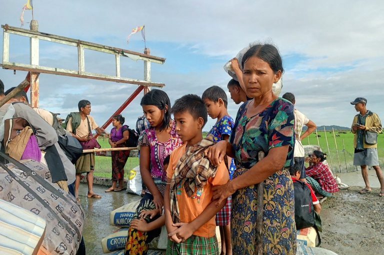 People flee fighting between the military and the Arakan Army in Rakhine State’s Pauktaw Township on November 19, 2023. (AFP)