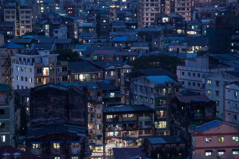 Residential buildings in Yangon in 2020. Soaring rent prices are pushing many residents to leave for more affordable hostels on the outskirts. (AFP)