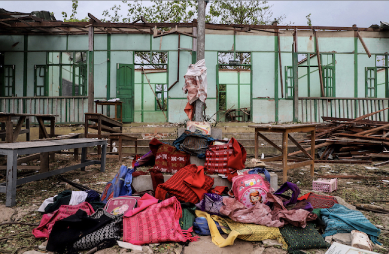 Students' bags are kept in front of a damaged school building in O Htein Twin village in Tabayin Township, Sagaing Region, on May 12. (AFP)