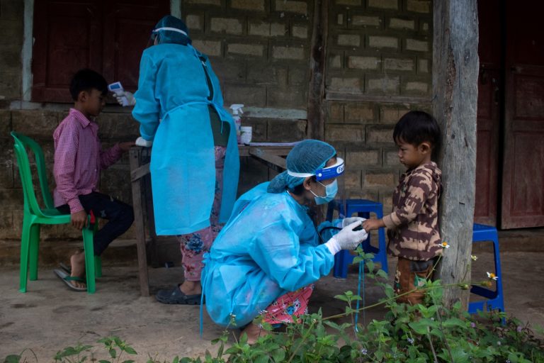 Healthcare workers in the Civil Disobedience Movement check children for signs of COVID-19 in Kayah State’s Demoso Township on October 17, 2021. (AFP)