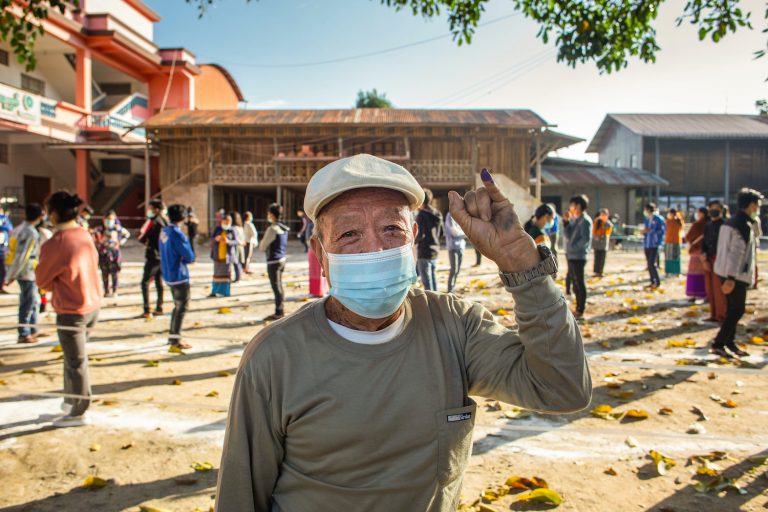 A man shows his inked finger after voting at a polling station in Muse, northern Shan State, on November 8. (Phyo Maung Maung | AFP)