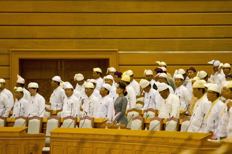 NLD lawmakers attend the first meeting of parliament, on November 16, 2015, after the general election that year. (AFP)