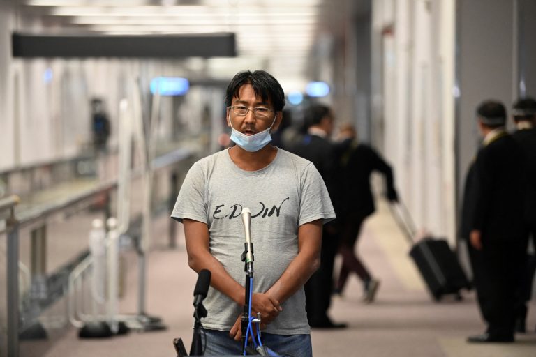 Deported Japanese journalist Yuki Kitazumi, who was arrested last month in Myanmar and held in Yangon’s Insein Prison for his coverage of the anti-junta uprising, speaks to the media after arriving at Tokyo’s Narita Airport on May 14. (AFP)