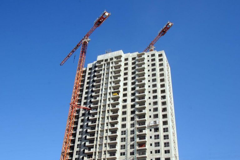 A Condo under construction towers over Yangon.