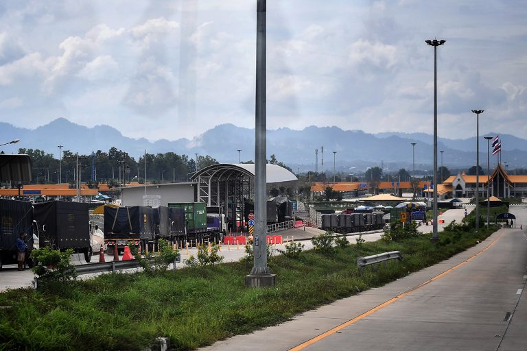 Trucks wait to be weighed along the road leading to the Friendship Bridge No.2 near the town of Mae Sot on the Thai-Myanmar border, on October 29, 2020. (AFP)