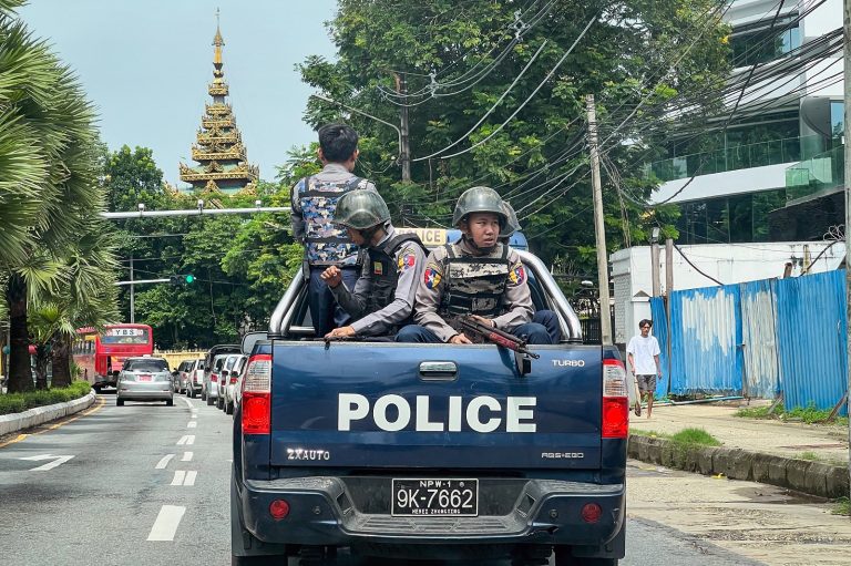 Police patrol on a street in Yangon on July 19, 2023. (AFP)