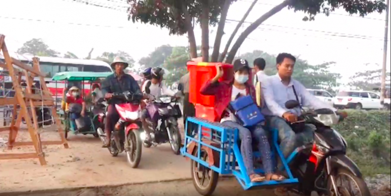 Families flee violence and martial law in Yangon's industrial Hlaing Tharyar Township on the morning of March 16.