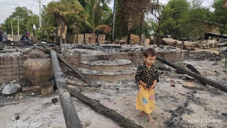 A child walks among the ruins of a home burned down during a military raid on November 28 in Mon Hla village in Sagaing's Khin-U Township. (Supplied by Khin-U Township True News Group)