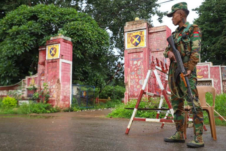A member of the Ta'ang National Liberation Army stands guard at a checkpoint in northern Shan State’s Kyaukme town on July 3. (AFP)