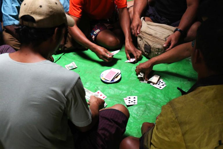 A group of gamblers play cards in Yangon in 2016. (Frontier)