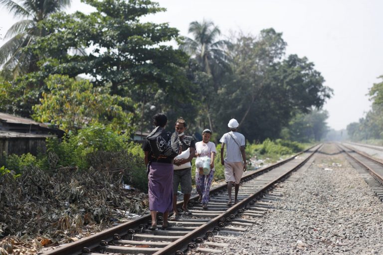 Rail workers leave their homes with whatever they can fit into plastic bin bags and carry on March 10, after soldiers and police evicted them for joining the Civil Disobedience Movement against the military government. (Frontier)