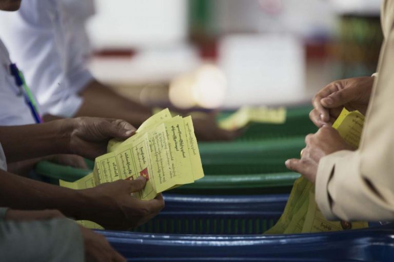 Officials count ballots at a polling centre in Mandalay on November 8, 2015. (AFP)