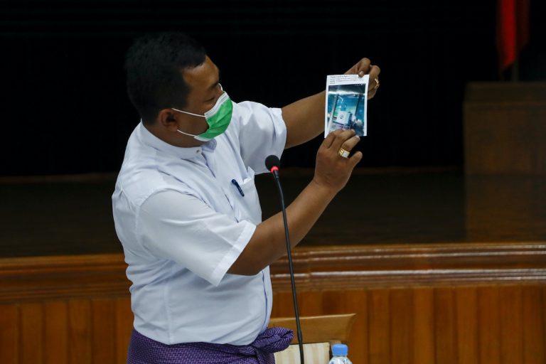 USDP candidate U Aung Myo Naing, who on November 8 lost the race for the Yangon Region Hluttaw seat of Hlegu-1, shows what he said is photographic evidence of the NLD committing voter fraud at a USDP press conference in Yangon on November 11. (Nyein Su Wai Kyaw Soe | Frontier)